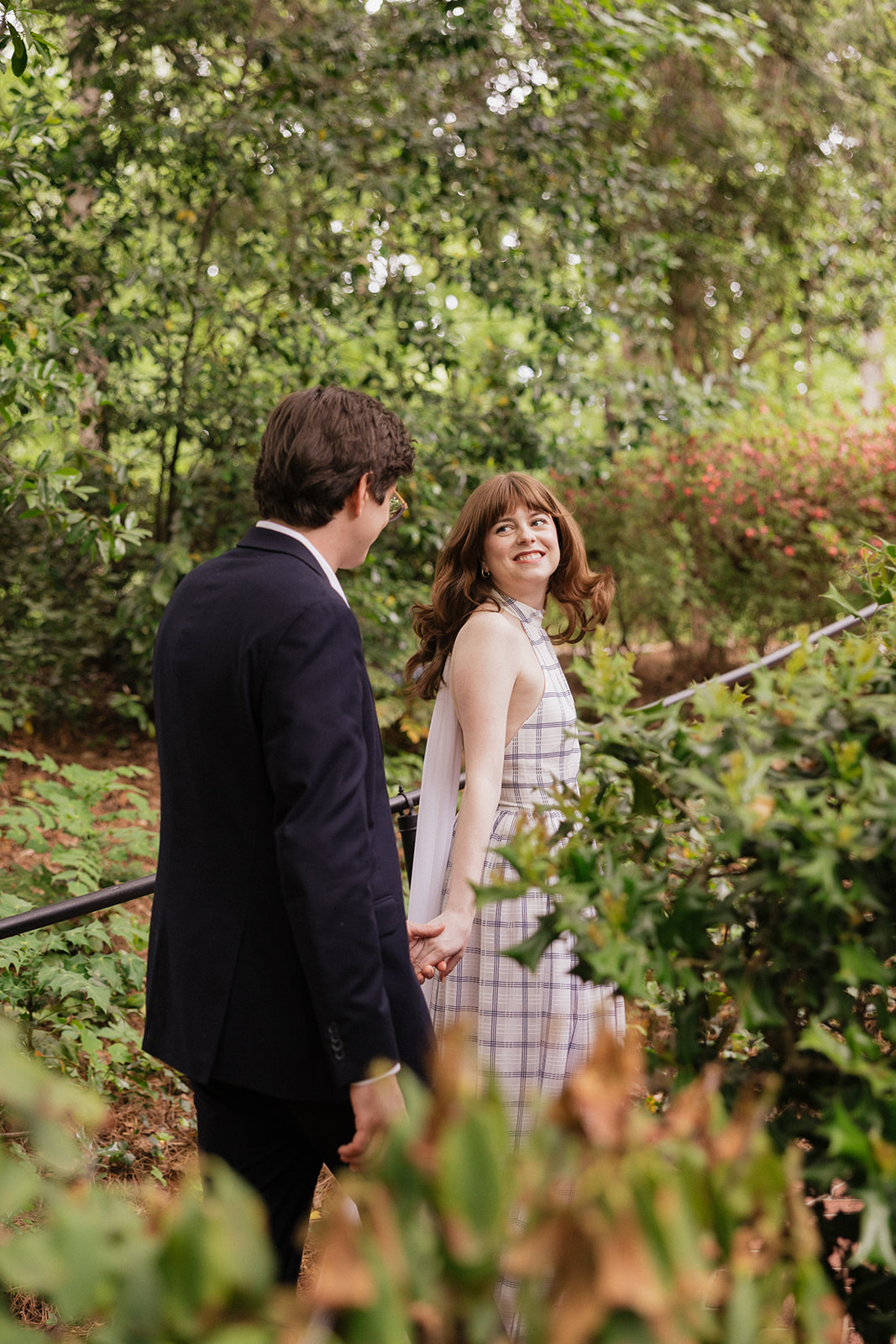 Elizabeth and Nicholas standing together in a garden.